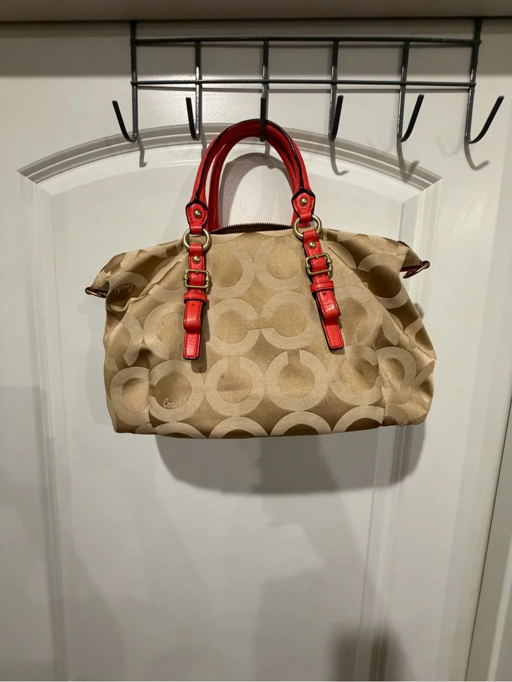 Coach Beige Signature Canvas Satchel with orange Trim and Handles. No strap